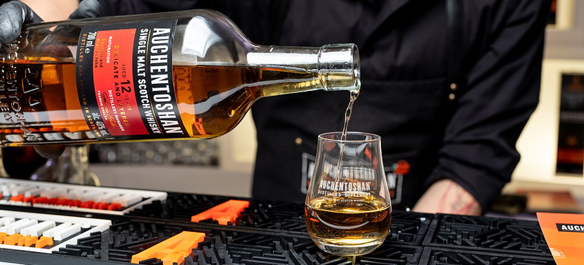 auchentoshan whisky being poured in a bar